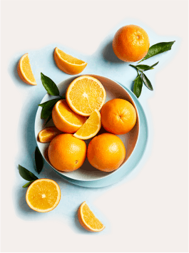 White crystalline ascorbic acid powder (pure Vitamin C) in a glass bowl with a wooden spoon, showing its fine texture.